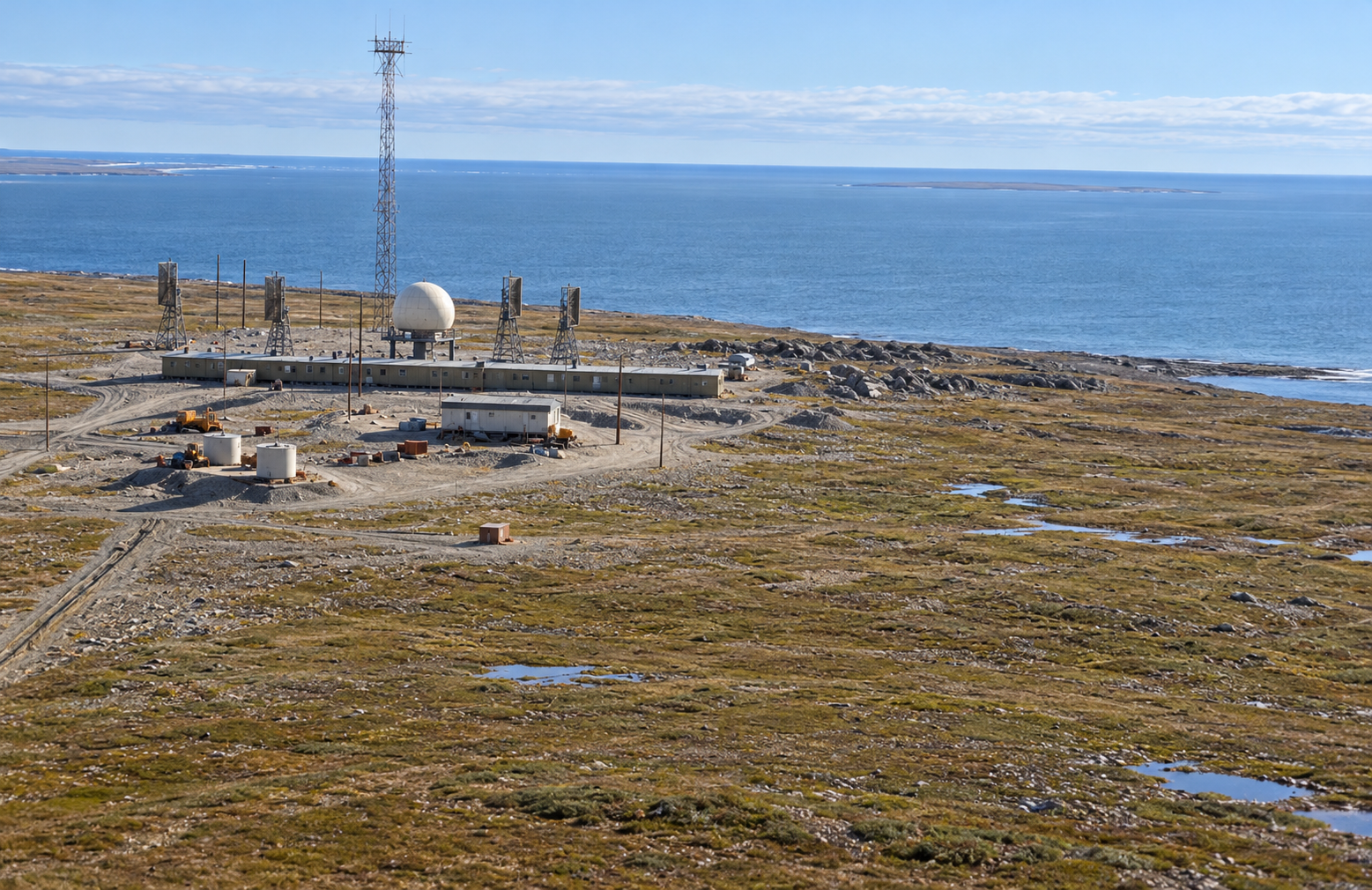 Interpretive reconstruction of Shingle Point BAR-2, with a radome, long connected module train, four communications billboards, separate garage and warehouse on the Arctic coastal plain