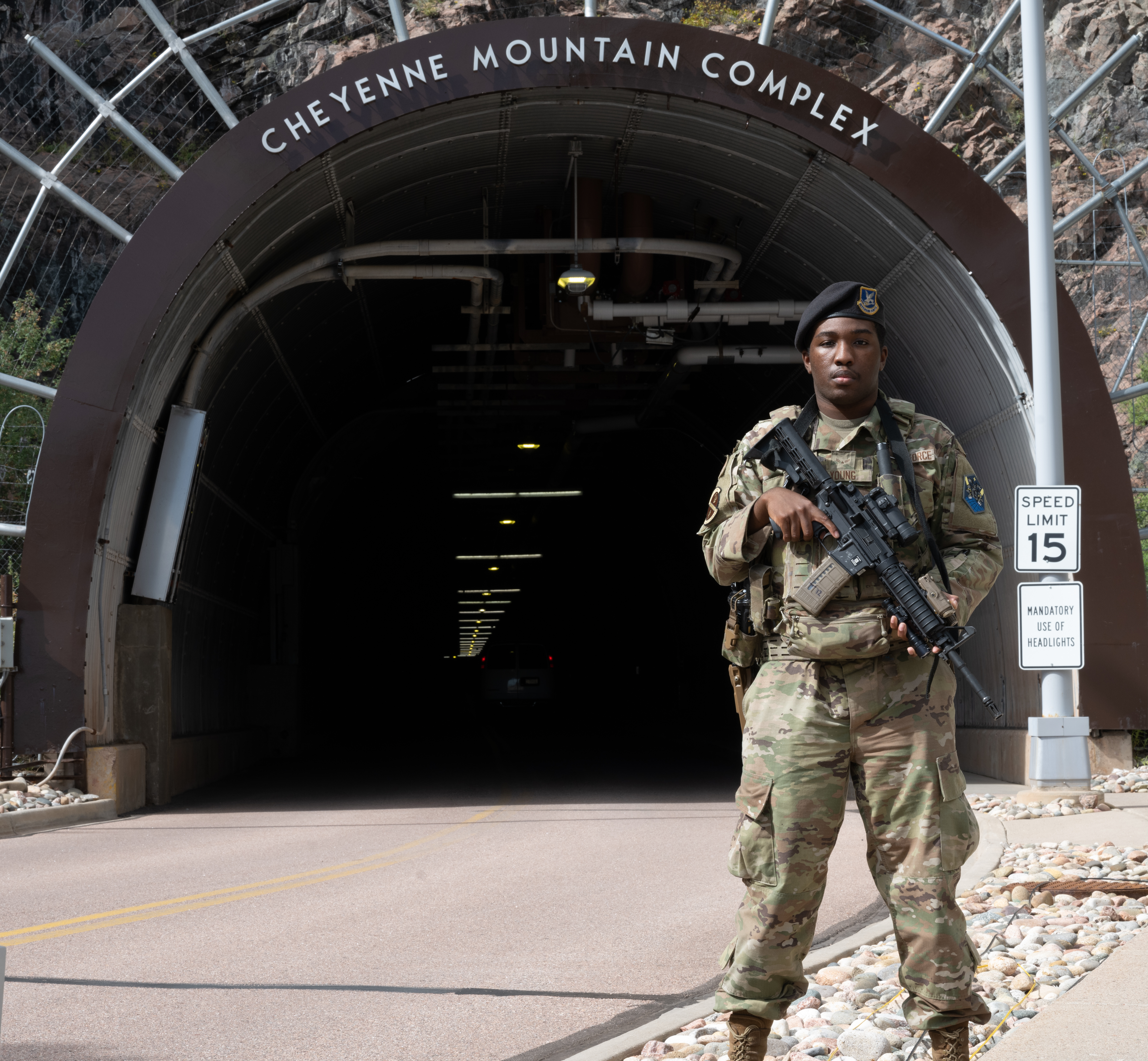 U.S. Air Force Airman 1st Class Darius Young, 21st Security Forces Squadron response force member, poses for a photo in front of the tunnel entrance at Cheyenne Mountain Space Force Station, Colorado, Sept. 11, 2025
