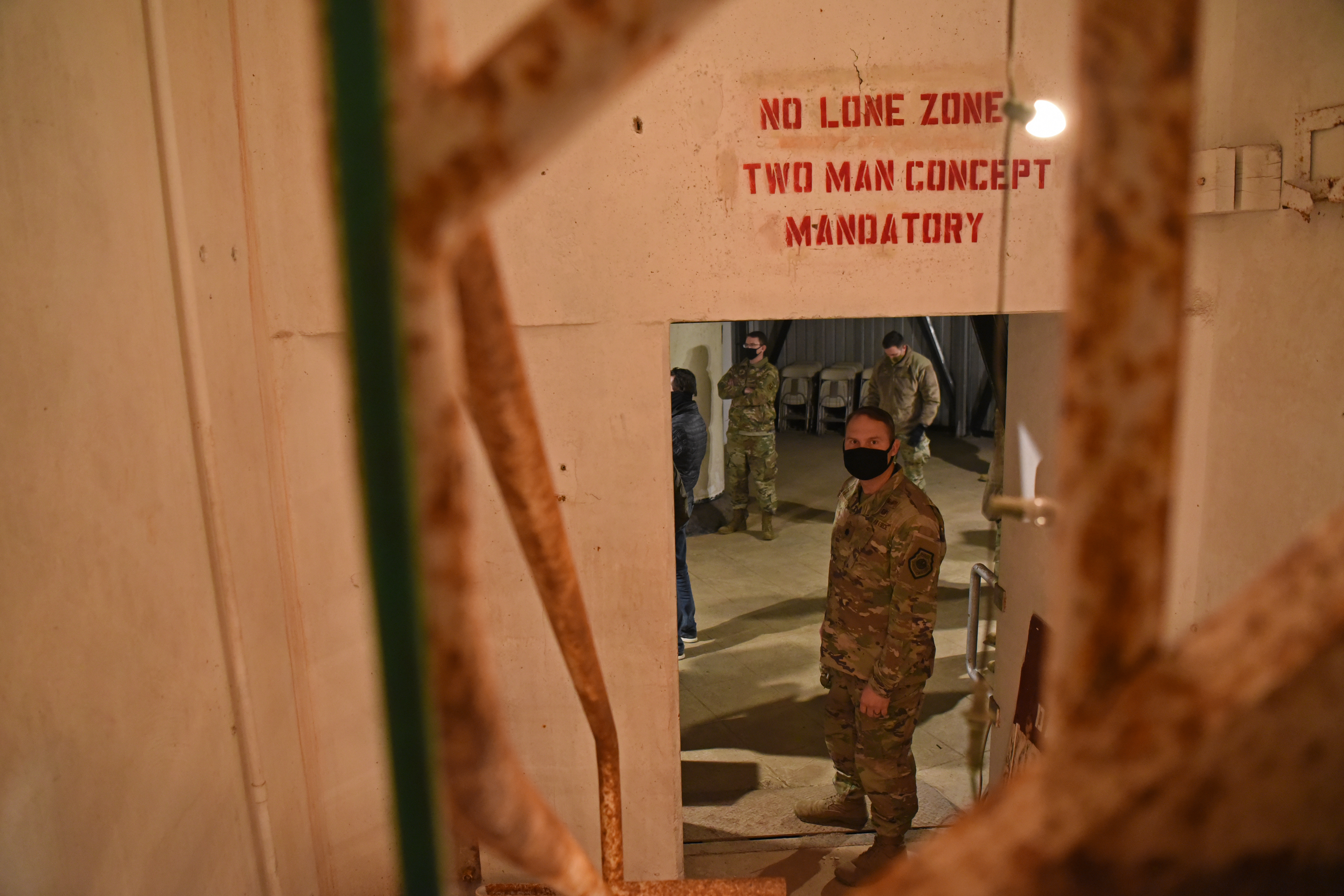 U.S. Air Force Lt Col. John Bergmans, 315th Training Squadron commander, enters the Lawn Atlas Missile Base's missile silo while exploring the narratives of actual personnel deployed to the site during the Cuban Missile Crisis in Lawn, Texas