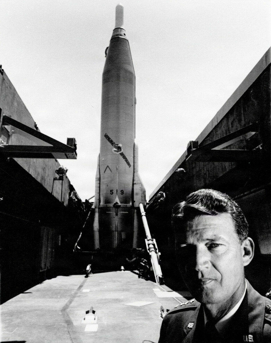 Gen. Bernard Schriever poses for a photo in front of an Atlas Missile