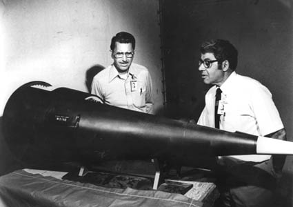 Weapons designers examine a W62/MK 12 reentry vehicle