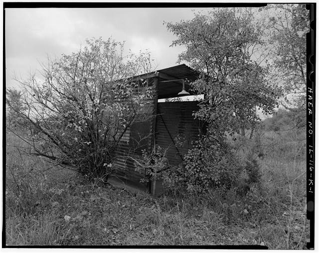 ACID STORAGE SHED, FRONT, LOOKING WEST