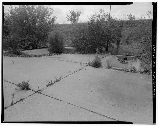 Acid Fueling Station - CONCRETE FORMATIONS IN LOWER AREA BETWEEN BERMS, LOOKING SOUTHEAST.