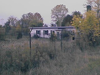 Ready building. The couple that bought the launch area from the government converted this building into their home. The gentleman passed away and the woman does not seem to be there anymore. They were elderly.