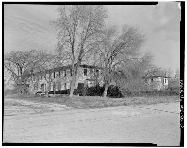 VIEW SOUTHWEST, NEAR MAIN GATE GUARD SHACK, mess hall/administration