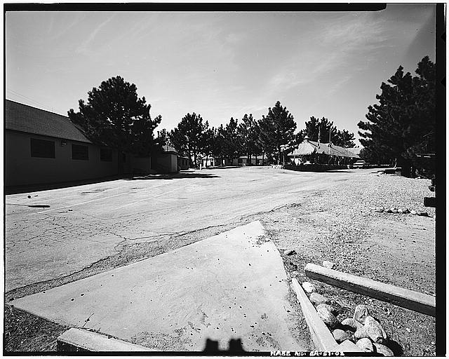 VIEW OF BARRACKS AREA, SHOWING ENTRANCE GATE AT IMMEDIATE LEFT, LOOKING WEST