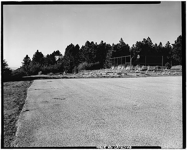 VIEW OF HELIPAD IN LAUNCH AREA, LOOKING WEST. BASKETBALL COURT ON RIGHT, RETAINING WALL VISIBLE