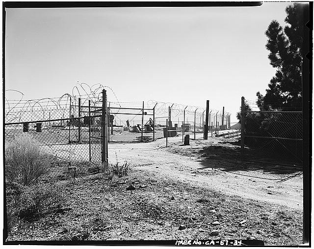 VIEW OF GATE INTO LAUNCH AREA, LOOKING SOUTHWEST; 'CATFISH' DOORS OPEN