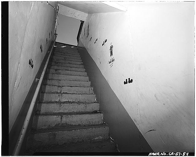 VIEW SHOWING GRAFFITI ON WEST WALL OF STAIRWELL INSIDE 'CATFISH' SILO