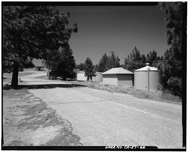 VIEW OF RADAR AREA, STORAGE BUILDINGS AND TANKS, LOOKING WEST