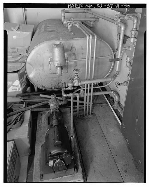 Launch Area, Generator Building, interior view showing diesel fuel tank, fuel pump (foreground) and fuel lines leading to power-generating units (removed) VIEW NORTHWEST