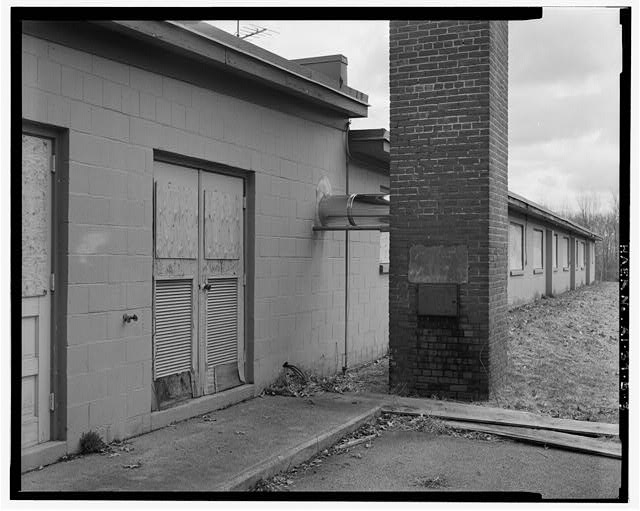 Control Area, Barracks, detail of chimney and rear door VIEW SOUTHEAST, WEST ELEVATION