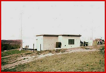 1957 Interconnecting Corridor between two vans.  RC on the left and BC on the right. Tall lightning rods are just visible by both vans. On the extreme right is one of the 208 volt 3 phase  400 cycle Hobart generators used to power the system.