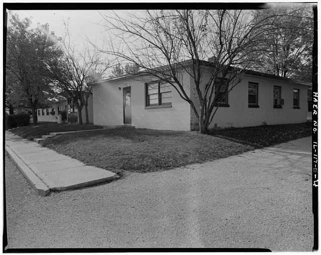 BARRACKS, WITH PARKING LOT IN FRONT, FRONT AND RIGHT SIDES, LOOKING SOUTH