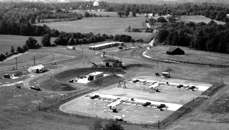 Looking almost due west across the launcher area (foreground) to the integrated fire control (IFC) area (center background) in 1964. The launcher area serves as the Anne Arundel County Police Academy, while the IFC area is the Davidsonville Family Recreation Center. 