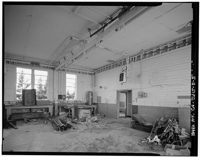 Mill Valley Radar Station  EXTERIOR VIEW OF THE NORTH REPAIR BAY OF THE MOTOR REPAIR SHOP, BUILDING 104, LOOKING WEST.