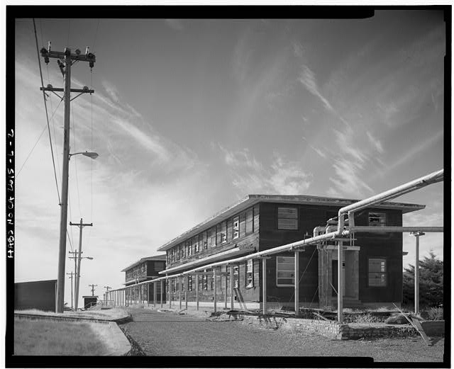 Mill Valley Early Warning Radar Station  OVERALL VIEW OF BACHELOR AIRMEN QUARTERS, BUILDINGS 208 AND 214, LOOKING SOUTHWEST.