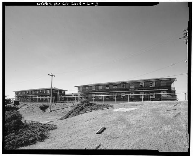 Mill Valley Early Warning Radar Station OBLIQUE VIEW OF BUILDINGS 208 AND 214 FROM BUILDING 204, LOOKING WEST-SOUTHWEST.