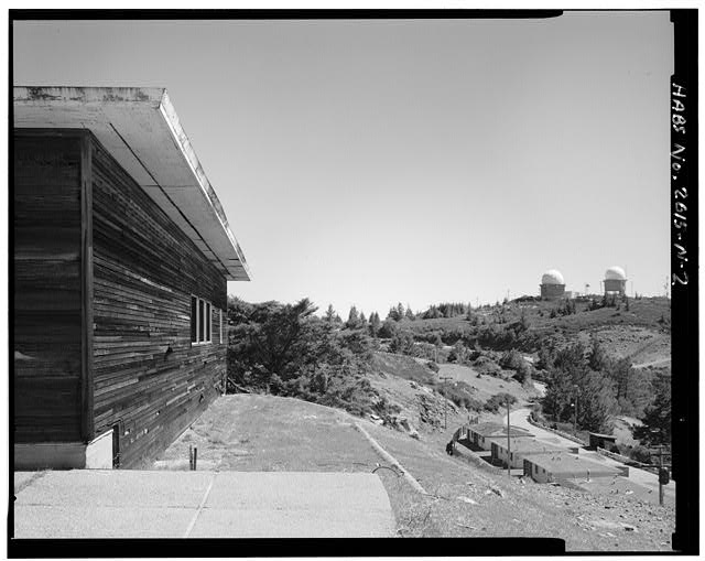 Mill Valley Early Warning Radar Station EXTERIOR OBLIQUE VIEW OF BUILDING 218 WITH DOMES TO THE RIGHT, LOOKING NORTHWEST.