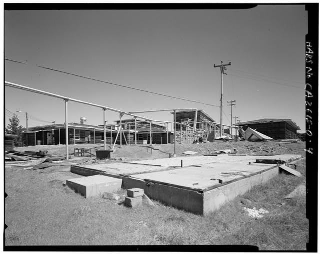 Mill Valley Early Warning Radar Station  EXTERIOR CONTEXT OF BUILDING 220 WITH FOUNDATION OF 224 IN THE FOREGROUND, LOOKING NORTH.