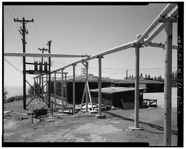 Mill Valley Early Warning Radar Station EXTERIOR WEST VIEW OF BUILDING 222 WITH BUILDING 223 IN THE RIGHT DISTANCE, LOOKING SOUTHWEST.