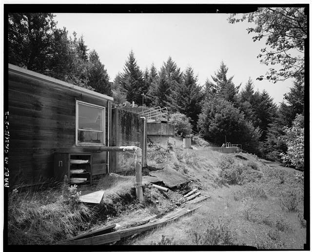 Mill Valley Early Warning Radar Station  VIEW OF SEWAGE TANKS WITH BUILDING 304, LOOKING WEST-SOUTHWEST. 