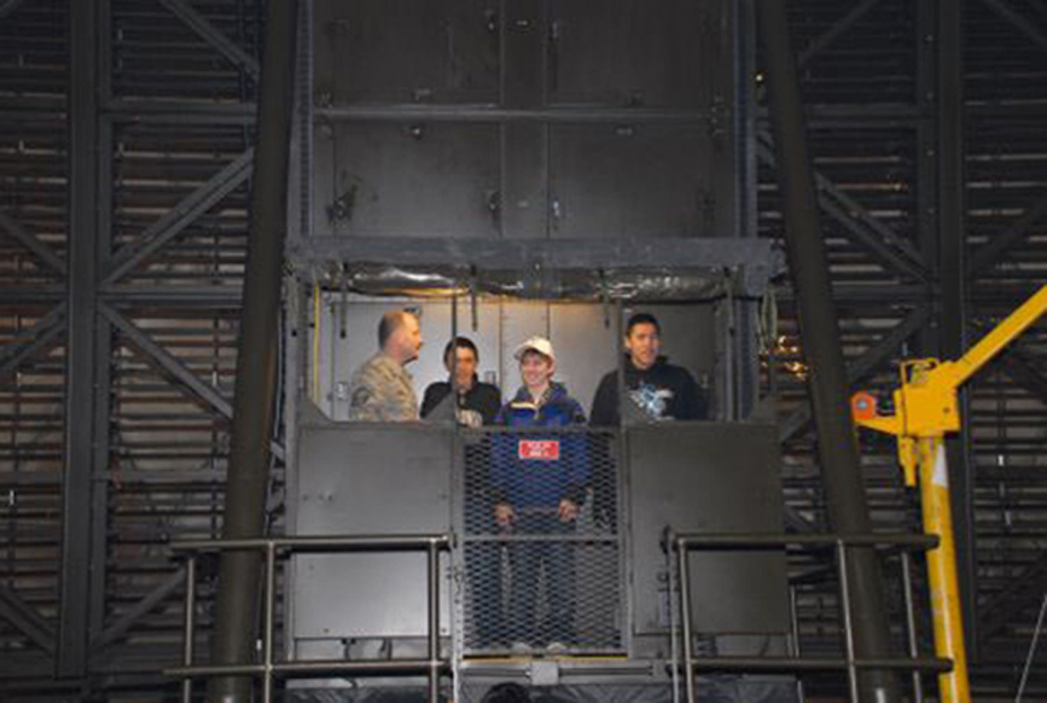 Air Force radar superintendent showing Kaktovik students the interior of the Barter Island radome in 2009