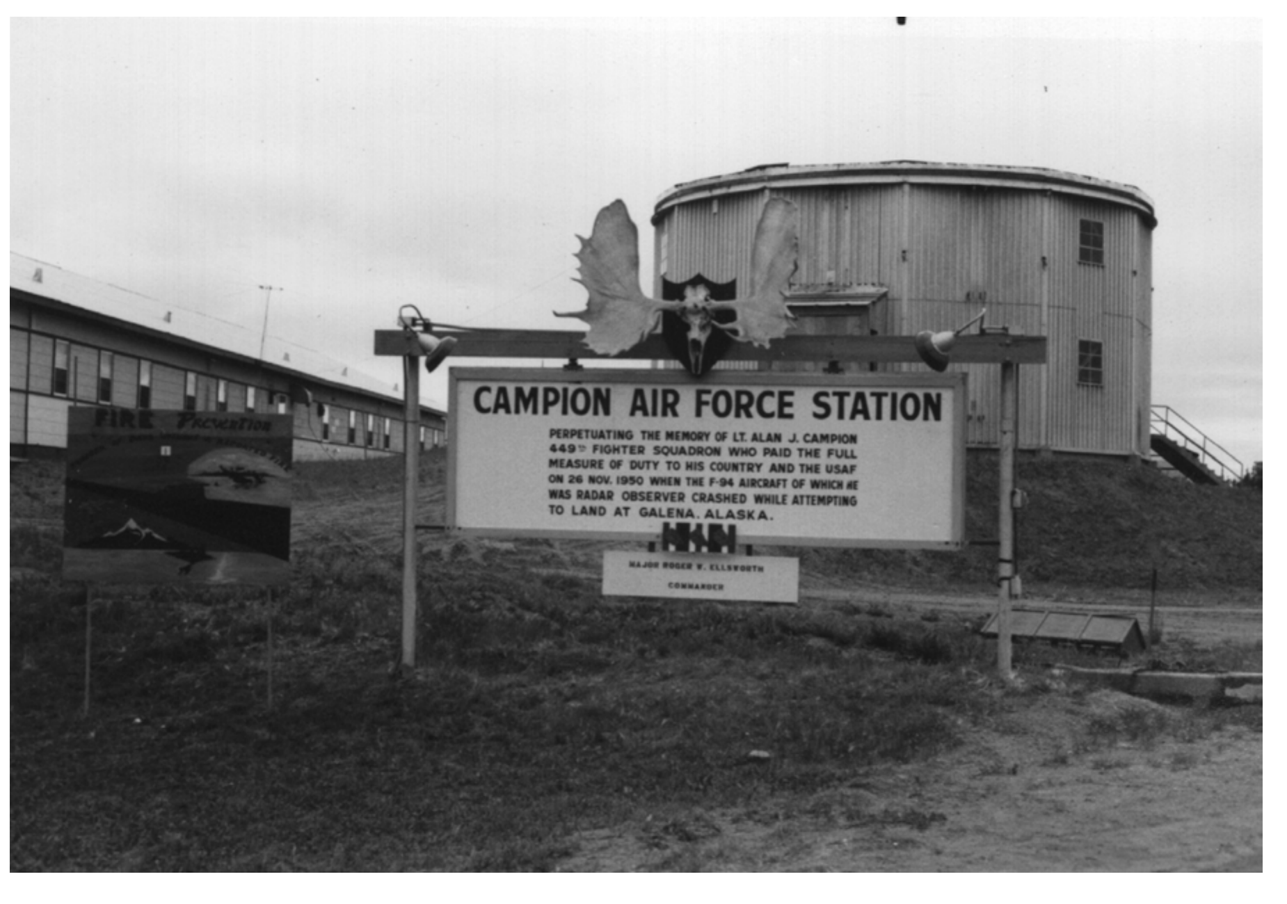 Historic Campion Air Force Station entrance sign naming Lieutenant Alan J. Campion, with a station building behind it