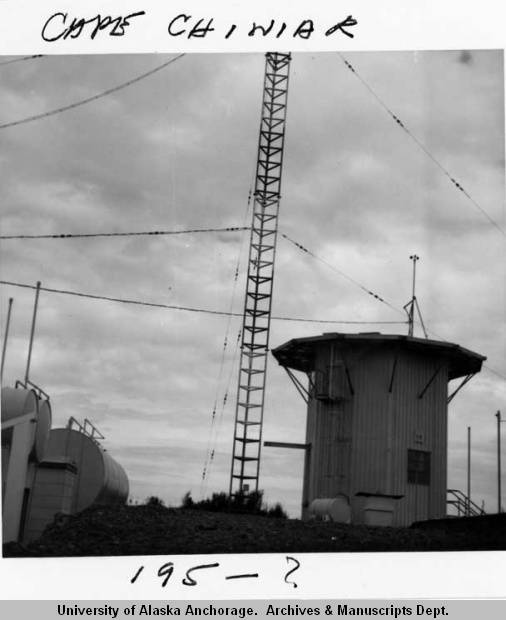 Archival Cape Chiniak photograph with a lattice tower and station structures