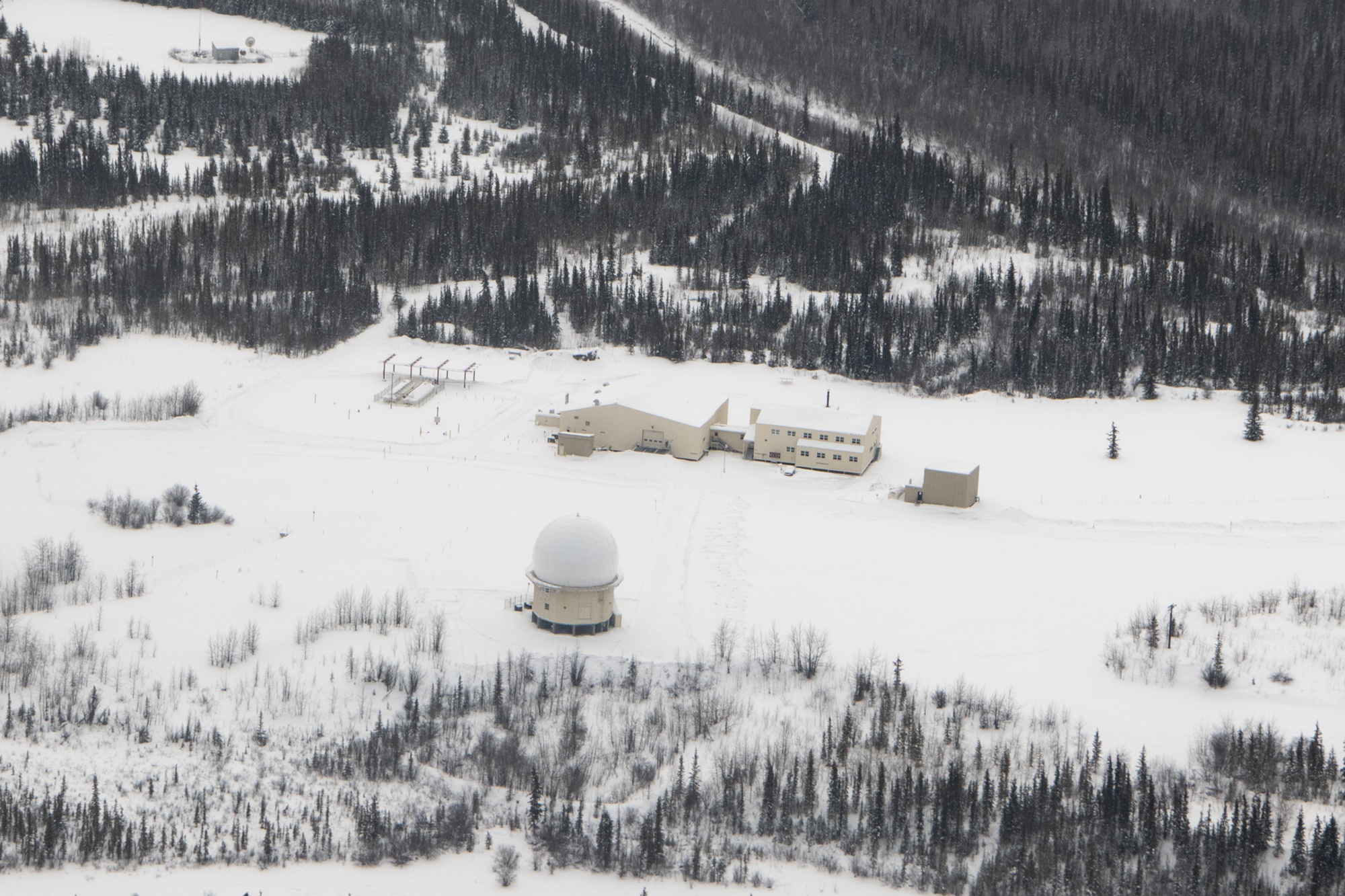 2023 U.S. Air Force aerial of Fort Yukon Long Range Radar Site showing radome and support buildings