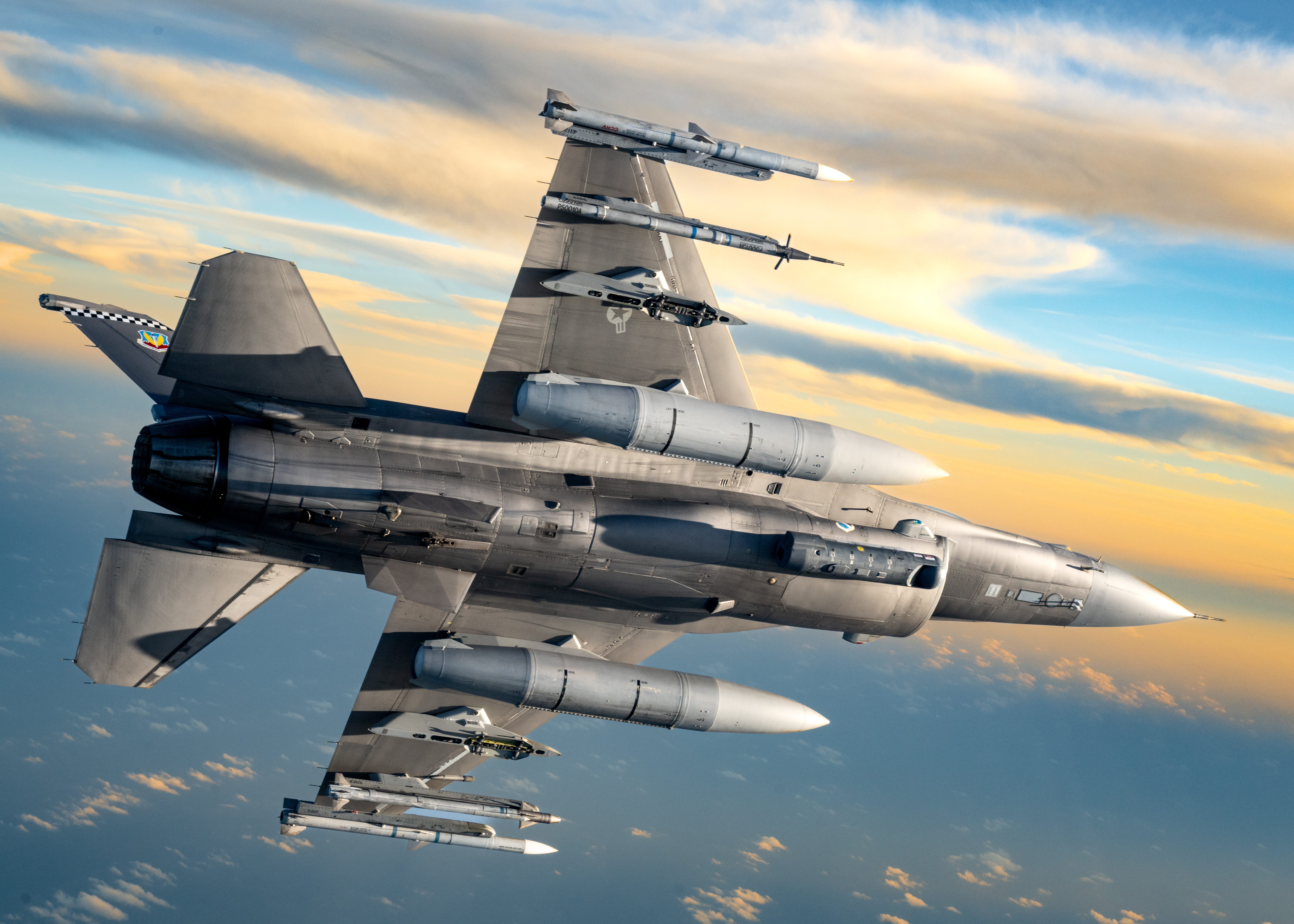 A U.S. Air Force F-16 Fighting Falcon flies over the gulf coast, November 25, 2025