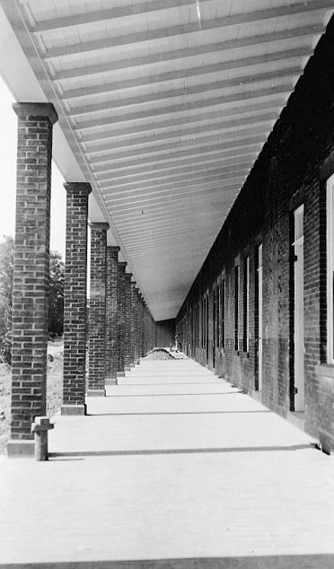 13.  Perspective View Down Restored Colonnaded Porch of Gorge Wall