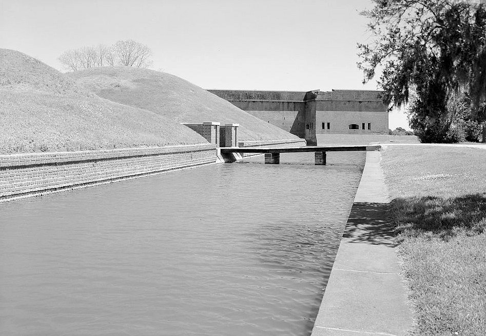 View of Fort, Moat, Drawbridge, and Pathway Leading into the Demilune Section of the Complex Looking from West to East.