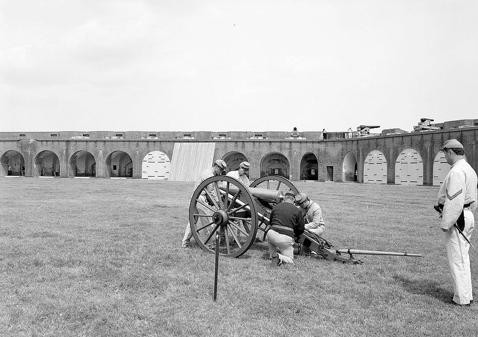 View of (Re-enactment) Troops Loading the Cannon; the Northeast Wall and East Corner of Fort Visible in Background