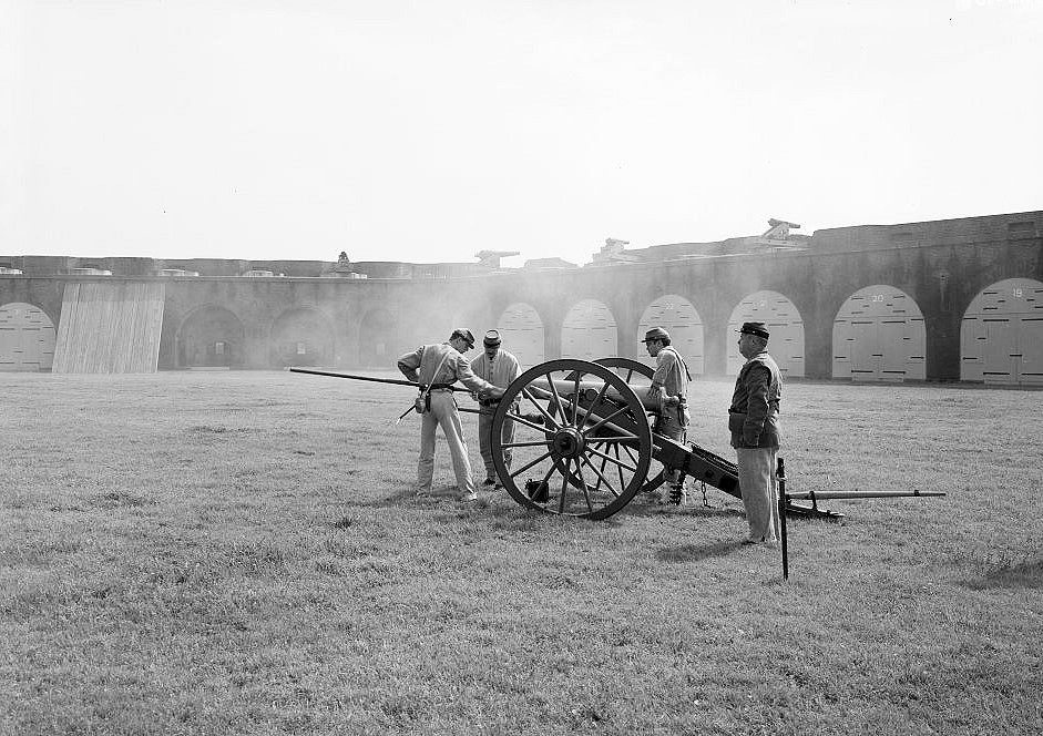 View of (Re-enactment) Troops Having Just Fired the Cannon; East Corner and Eastern Half of the Southeast Wall in Background