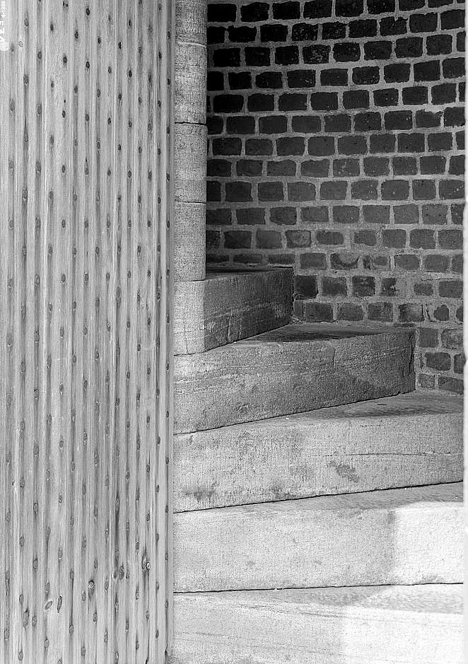 Detail View of Door and Steps Arising behind It