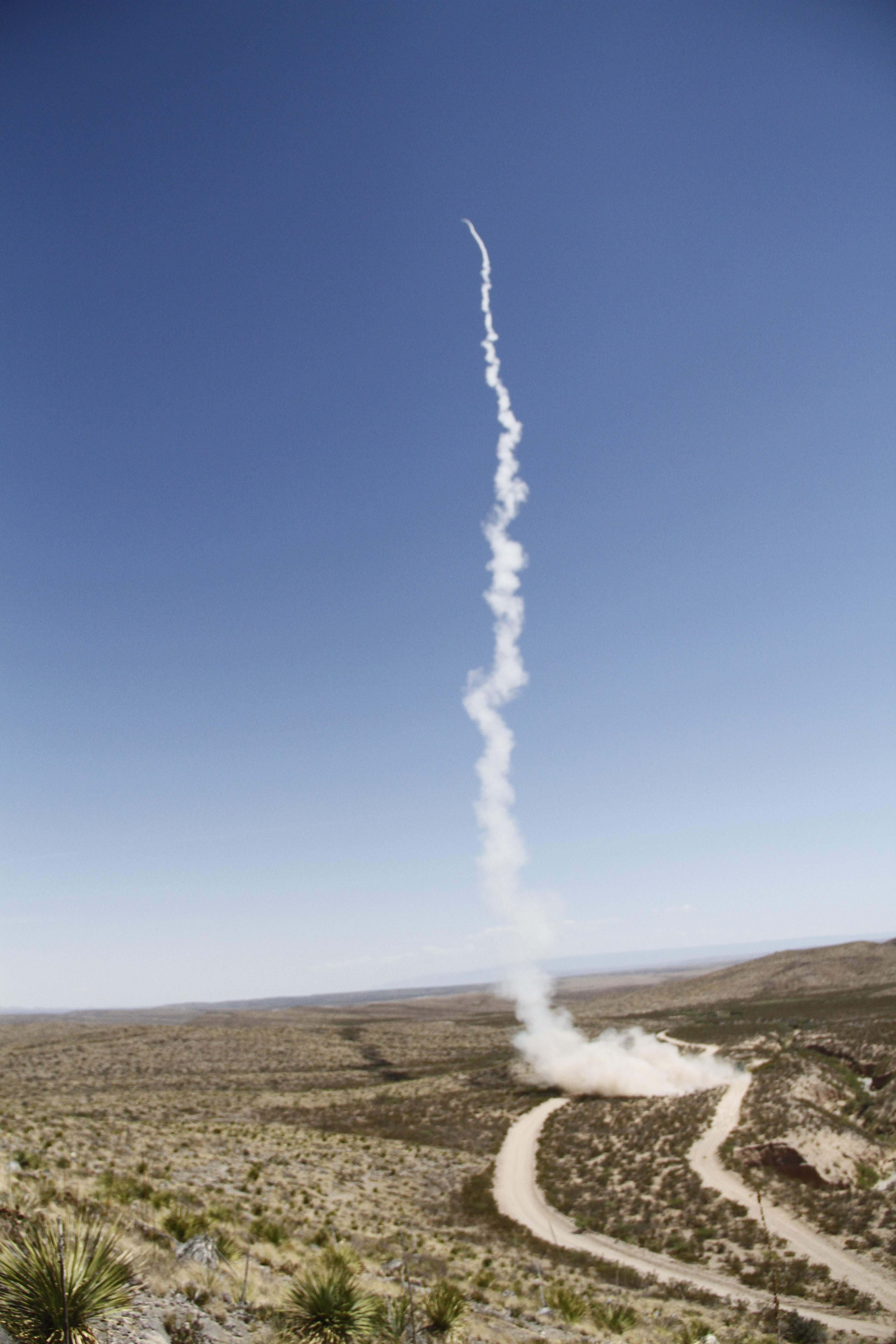 A guided multiple launch rocket system (GMLRS) rocket is launched from a High-Mobility Artillery Rocket System, mounted on a truck, during exercise Iron Rage at McGregor Range