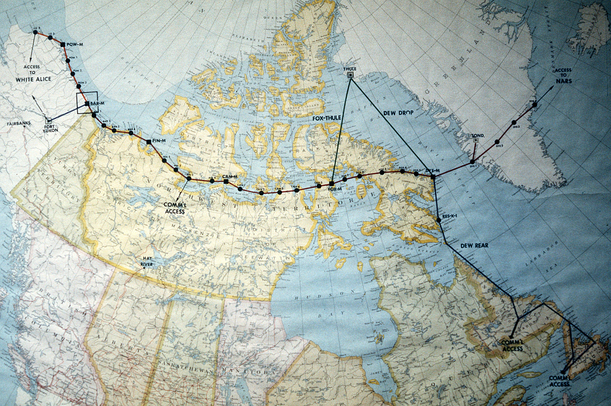 1987 U.S. Air Force archival map tracing the DEW Line from Alaska through northern Canada to Greenland, with communications access marked