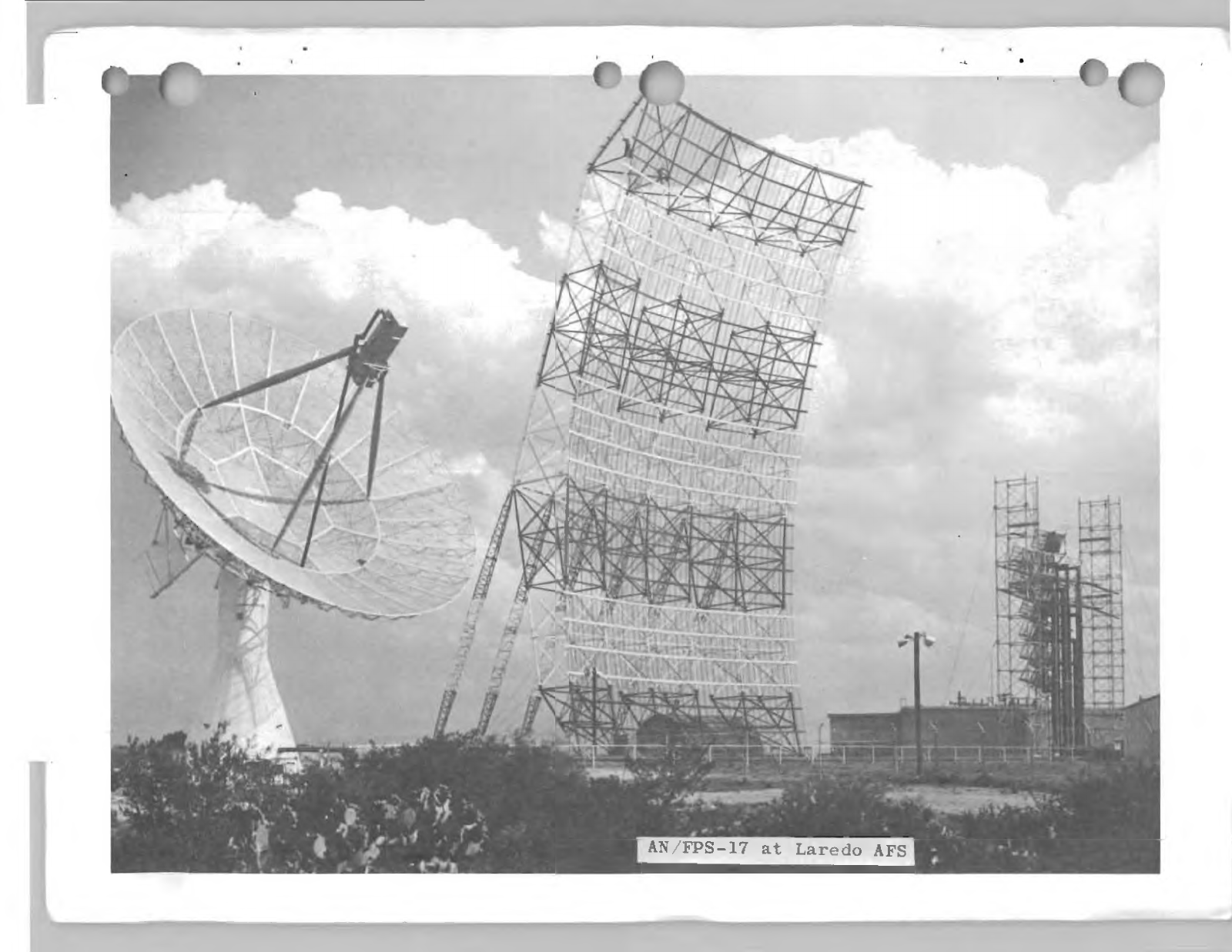 Aerospace Defense Command archival photograph of the Laredo radar site with the AN/FPS-78 tracking dish at left and fixed AN/FPS-17 array at center